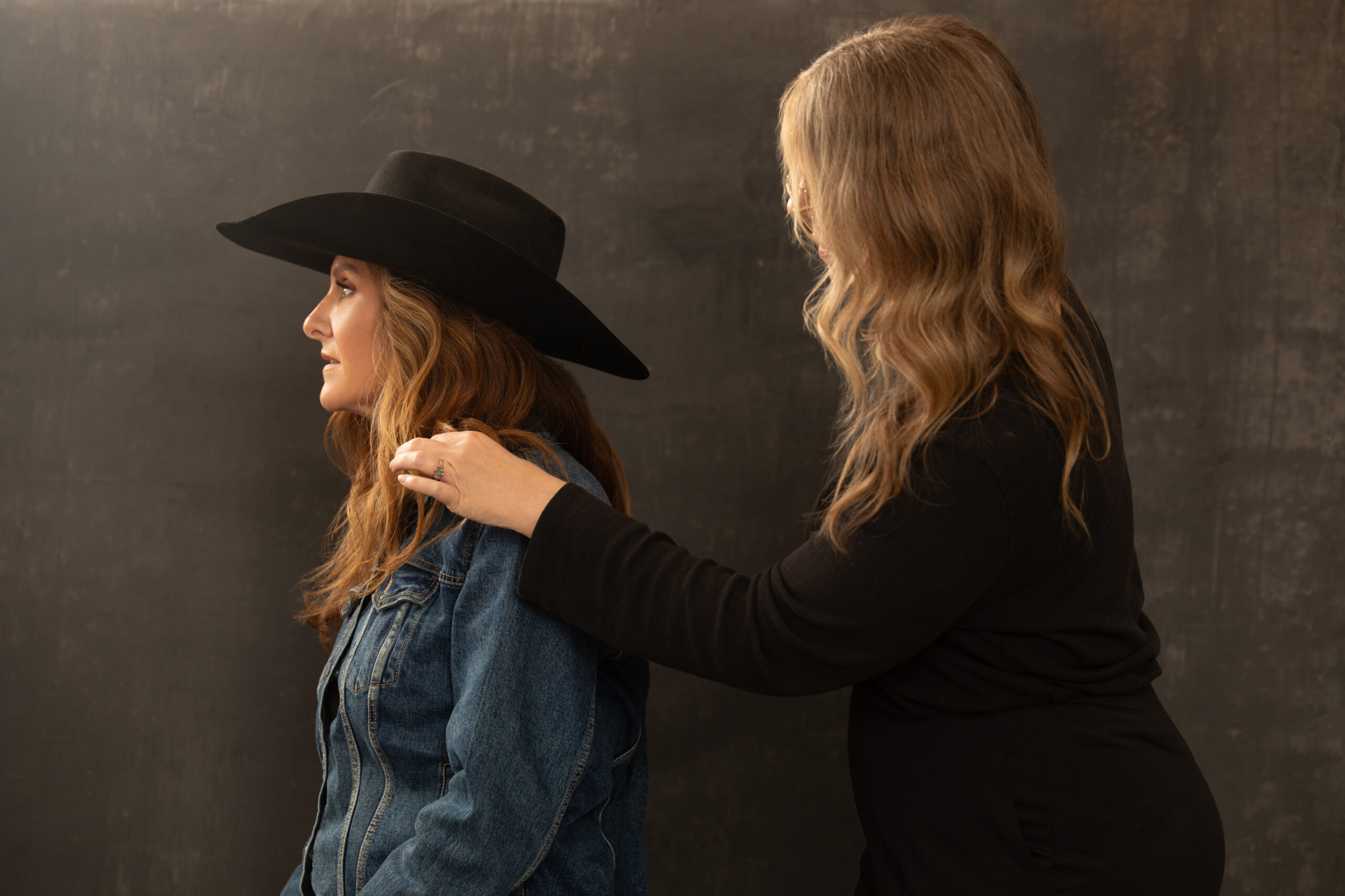 Heather Maria helping a client with beauty during a photo shoot